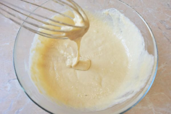 Gradually add the sifted flour to the mixture and knead the dough. The amount of flour should be adjusted to achieve the desired consistency for the finished dough. You want the dough to be thick, similar to thick sour cream, so avoid adding excessive flour.


