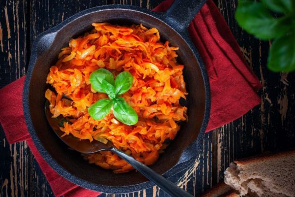 Fried Carrots With Onions in a Frying Pan