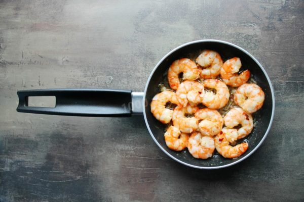 When the shrimp curl into rings, they are ready. Overcooking will result in tough and rubbery shrimp.


