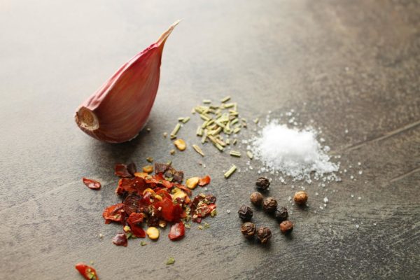 Peel the garlic cloves. You can substitute the hot pepper with ground black pepper or allspice. Adjust the amount of hot pepper to your taste, or omit it altogether. If you don't have dried rosemary, you can use a fresh sprig.



