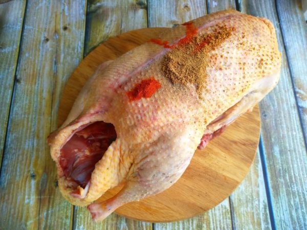 Rub the goose inside and out with the dry spice mixture. Let the goose rest at room temperature for one hour. Please note that this recipe does not use salt; soy sauce replaces it. If you prefer, you can rub the bird with salt after it rests.

