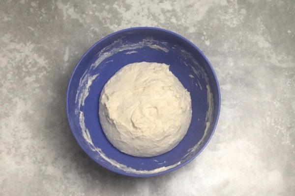Form the dough into a ball, cover the bowl, and place it in a warm spot for an hour to allow it to rise. I placed the bowl in a cold, unused oven, which is warm and draft-free.

