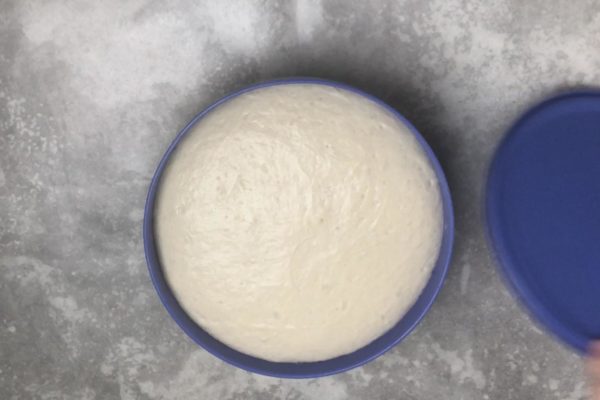 After an hour, the dough should have doubled in size. Gently press it with your fingers.

