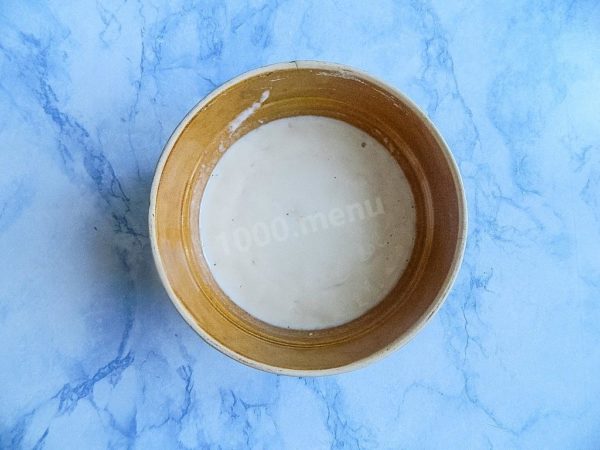 If you see a fluffy cap on the surface, it means that the yeast has become active, and you can proceed with the cooking. If this doesn't happen, then you may need to replace the yeast. With inactive yeast, the dough won't work.


