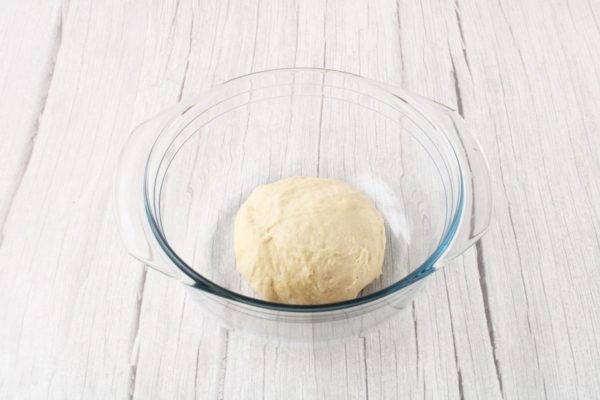 The dough should become uniform and not stick to your hands. This consistency will allow the larks to hold their shape well during baking. Avoid making the dough too stiff, as it may result in heavy baked goods. Cover the bowl with plastic wrap and let it rise in a warm place for 60-80 minutes.



