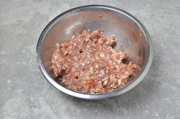 Mix the minced meat until it reaches a viscous state, ensuring it is well-molded and doesn't fall apart. If needed, add another egg or a bit of water to achieve the desired consistency.


