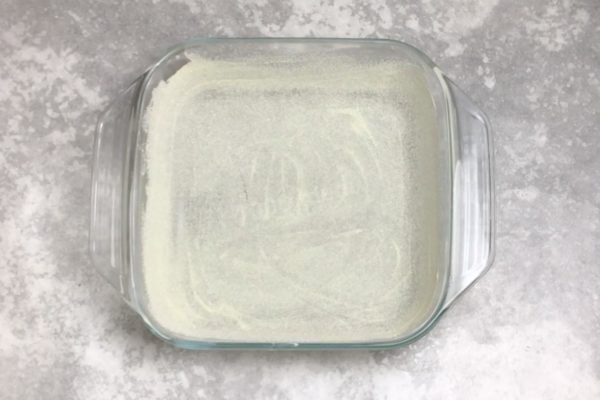 Grease a baking dish with softened butter, then sprinkle it with semolina. The semolina will adhere to the butter, forming a crust during baking, making it easier to remove the casserole from the mold.
