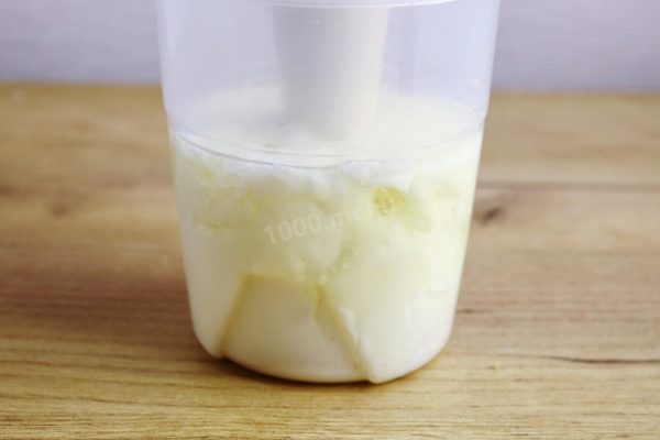 With the immersion blender held at the bottom of the bowl, blend until the mixture turns mostly white.

