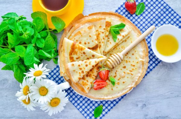 Serve the pancakes with your choice of sweet or savory toppings. These pancakes are suitable for stuffing as they are thin and won't tear easily. Enjoy your meal!



