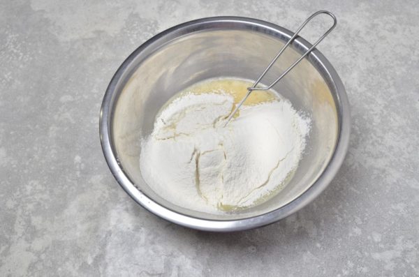 Sift the flour into the bowl. Sifting helps remove any impurities and aerates the flour, which is beneficial for the quality of the pancakes. You may need slightly more or less flour, so adjust the consistency as needed.


