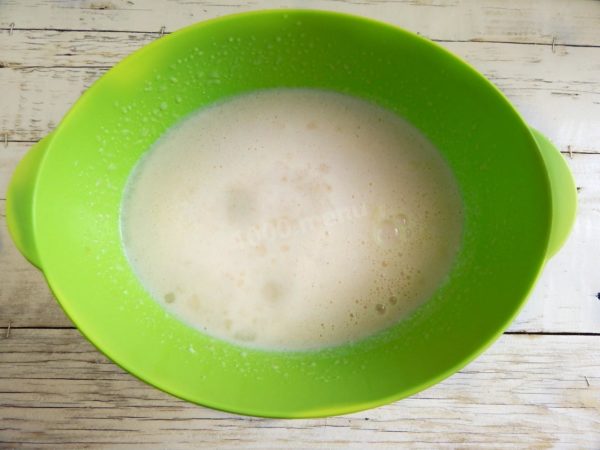 Slowly pour in hot (but not boiling) water while simultaneously stirring the mixture vigorously with a whisk to prevent the eggs from cooking.


