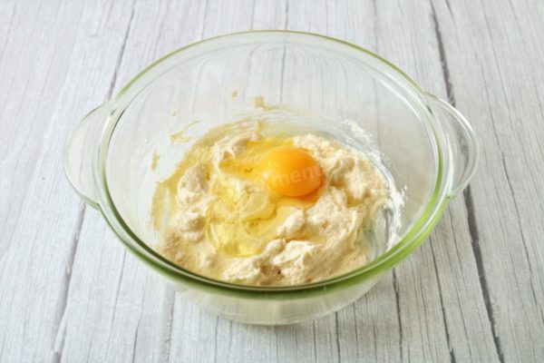 Wash the egg and pat it dry with paper towels. Add the egg to the sugar-butter mixture. Beat until smooth, ensuring the egg is evenly incorporated throughout the mixture.

