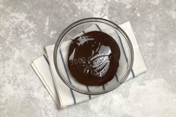 Melt the chocolate. Break it into pieces and place it in a bowl. You can melt it on the stove, using a double boiler, or in the microwave. Be careful not to overheat the chocolate—use minimal heat if using a double boiler, and select a short time and medium power if using the microwave.

