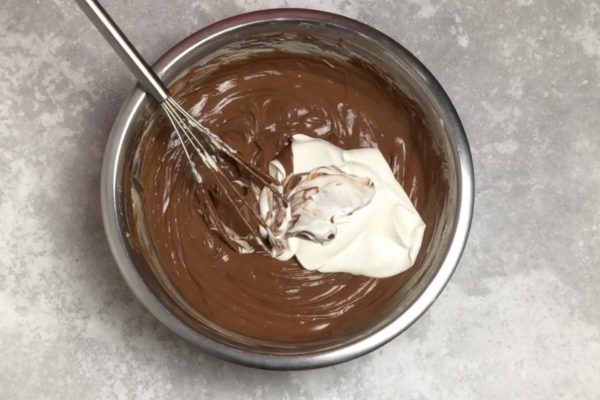 Gently fold in the sour cream using a whisk, being careful not to overmix. The filling may vary in consistency, ranging from runny to quite dense, resembling sour cream. The density of the egg, sour cream, and cream cheese mixture can vary due to factors such as the density and moisture content of the cheese, the consistency of the sour cream, and the type of eggs used.

