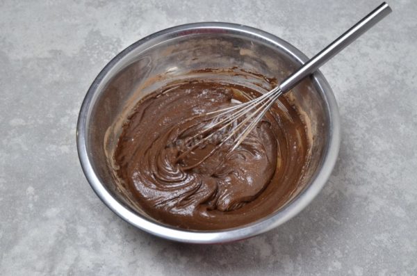 Mix the ingredients until a smooth batter forms, resembling thick sour cream in consistency. If the batter is too thick due to the flour quality, consider adding a small amount of warm milk to adjust the consistency.

