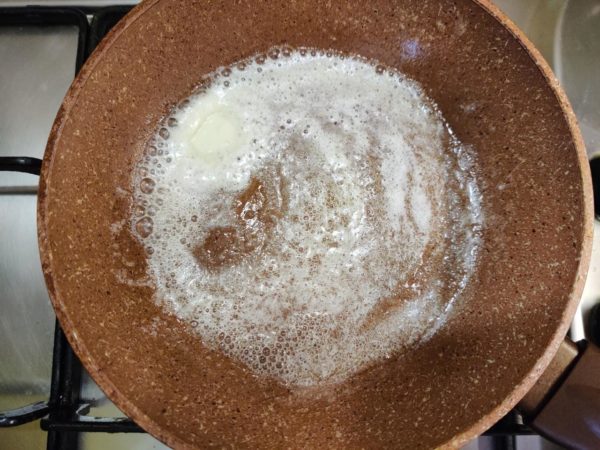 Warm a small non-stick skillet over medium heat and melt some butter in it. Using butter instead of oil enhances the flavor of traditional scrambled eggs.


