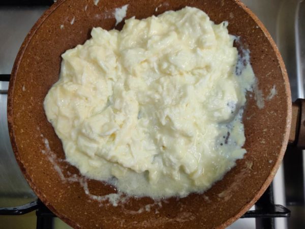 Stir the eggs continuously with a spatula, moving it across the pan to prevent large curds from forming. The cooking time may vary depending on your stove, but typically it takes just a few minutes. When the eggs are soft, fluffy, and slightly moist (as shown in the reference photo), they are done. This texture marks the perfect classic scrambled eggs.



