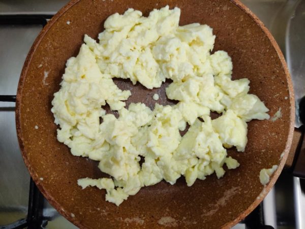 Optionally, you can continue cooking the eggs for an additional 30 seconds to achieve your preferred firmness. The key is to avoid browning; ideal scrambled eggs are light, slightly moist, and pale in color. Season with black pepper to taste and serve immediately, sometimes straight from the pan they were cooked in. Enjoy your classic scrambled eggs!





