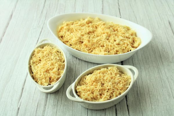 Sprinkle the remaining grated hard cheese over the top of the pasta.

