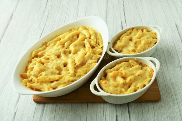 Bake the macaroni and cheese in a preheated oven at 180°C (350°F) for approximately 20 minutes.

