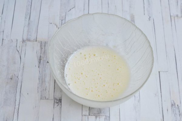 Beat the mixture with a mixer until it forms a fluffy foam and the sugar and salt crystals are fully dissolved. Slightly warming the milk facilitates faster dissolution of sugar and salt, which tend to dissolve slowly in cold milk. Avoid overbeating the eggs, as it may cause the air bubbles that contribute to the dough's fluffiness to dissipate.

