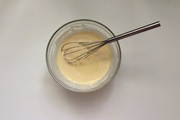 Incorporate vegetable oil into the batter and mix thoroughly.

