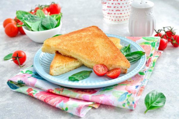 If you used toast bread, cut the sandwich diagonally into two halves—this is the classic presentation. Enjoy your delicious cheese sandwich!
